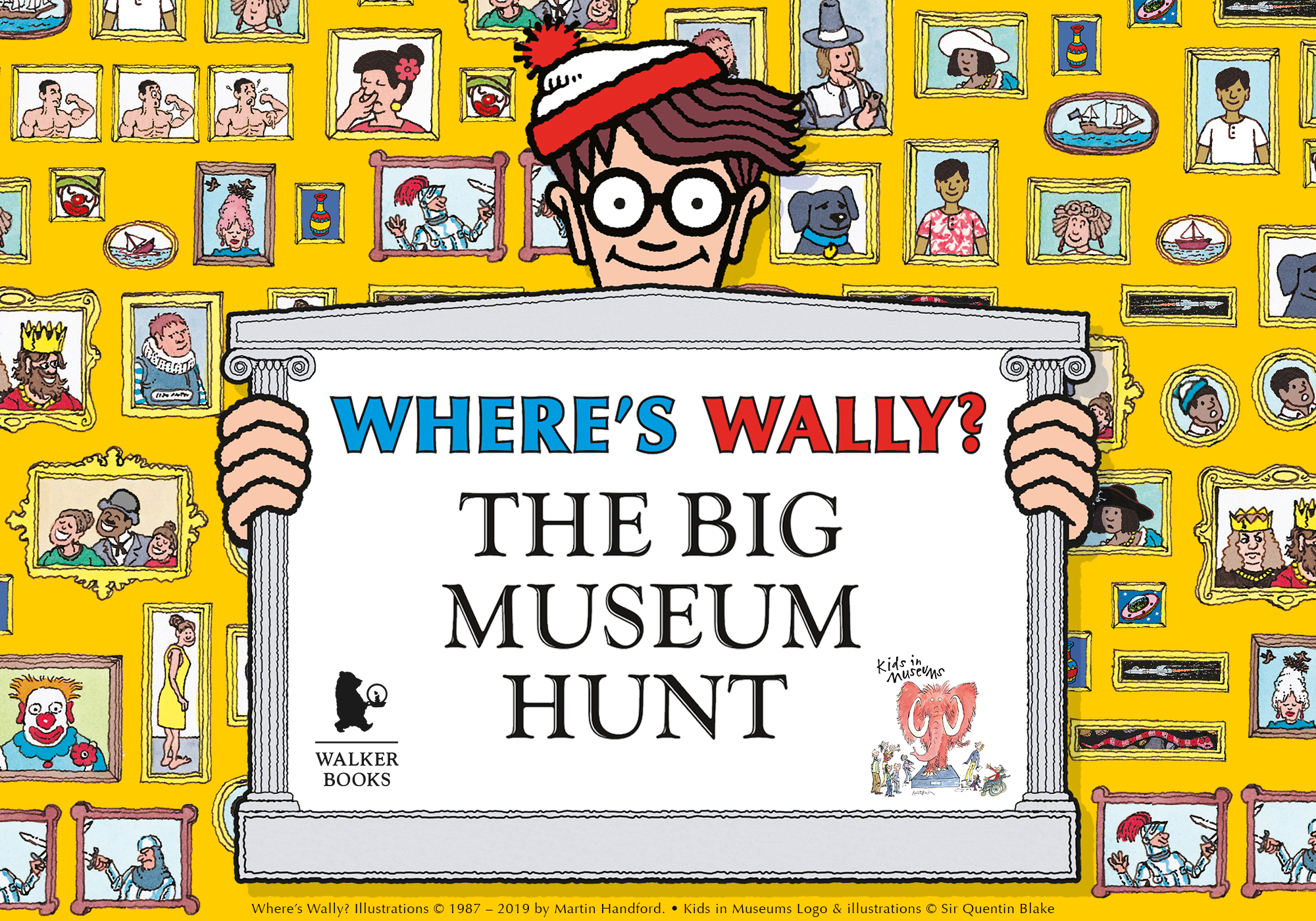 Cartoon of Wally standing in front of gallery wall holding a picture frame that says Where’s Wally: The Great Museum Hunt.