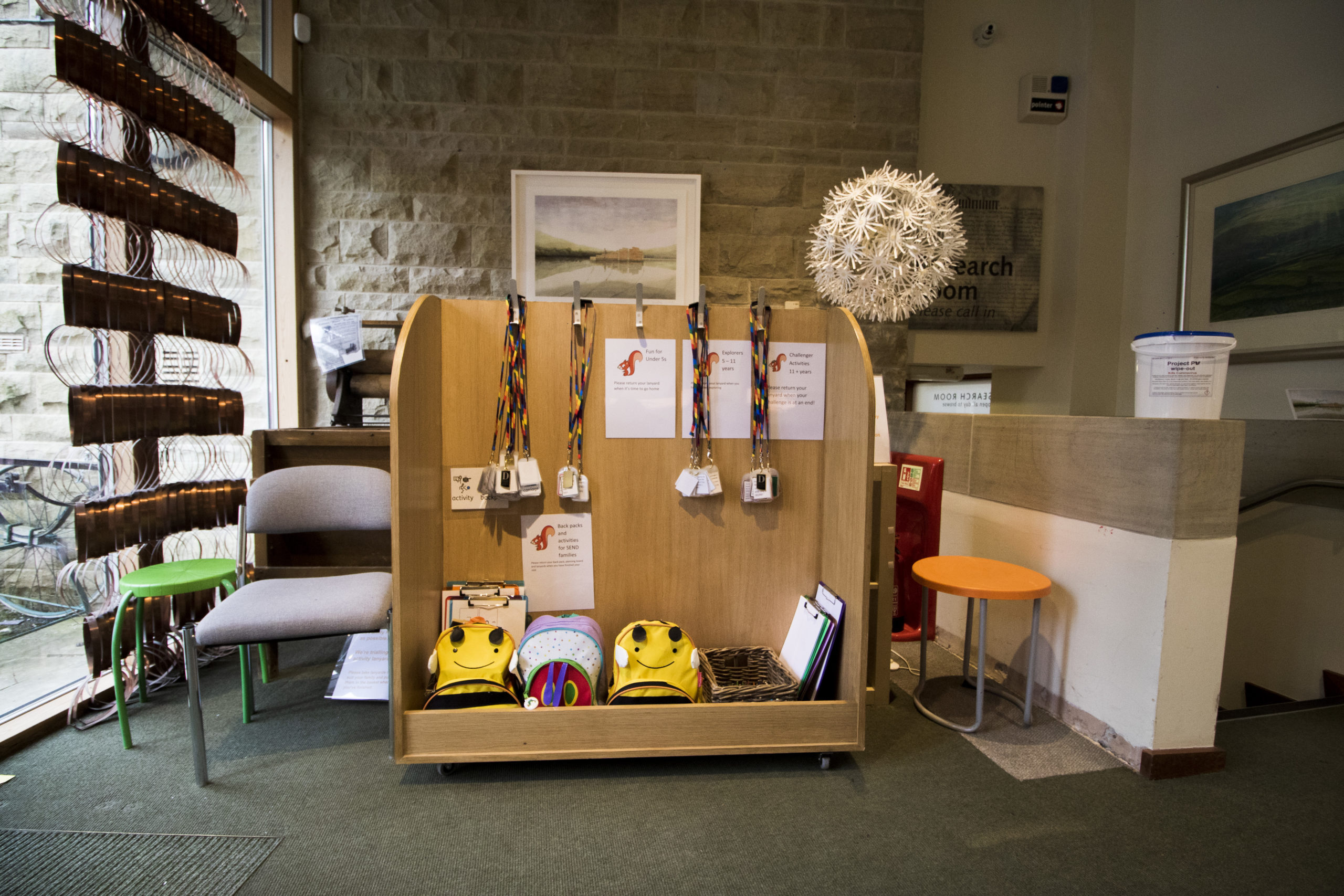 The Dales Countryside Museum foyer filled with resources, lanyards and backpacks.