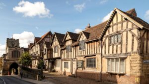 A row of medieval houses on a sunny day.